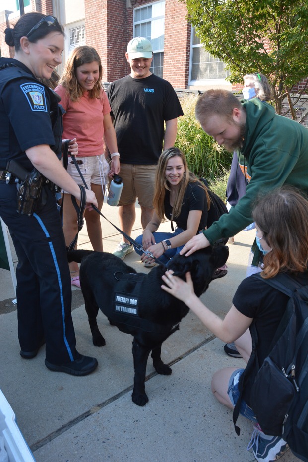 Vertical photo of K9 Odin with students