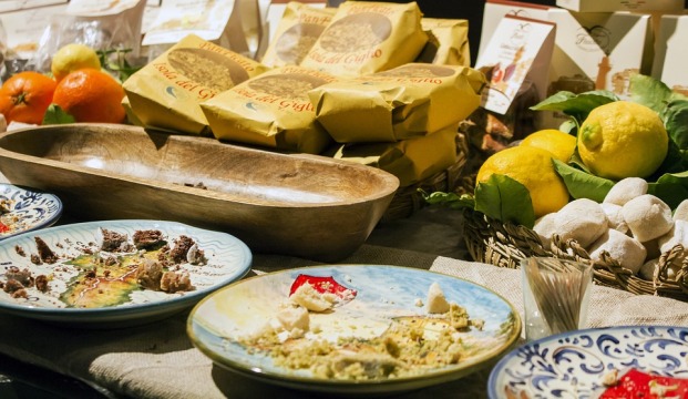 Plates and different foods on a table in Italy