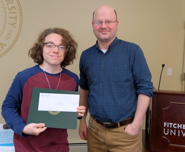 English Writing Awards male student and professor in President's Hall