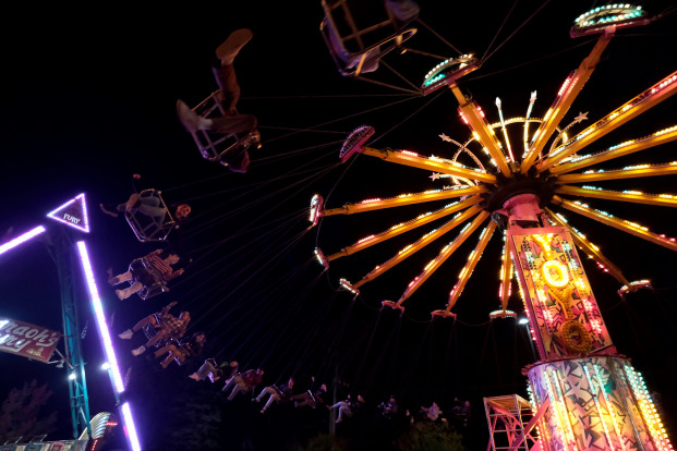 Photo of rides at Homecoming carnival in Ross Street lot
