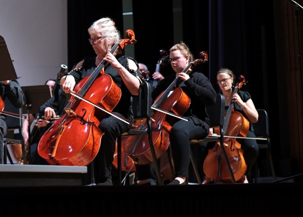 Female cello players in the community orchestra