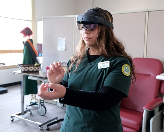 Nursing student Kaleigh Visbaras with augmented reality headset