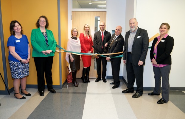 Group photo of biotech lab ribbon cutting