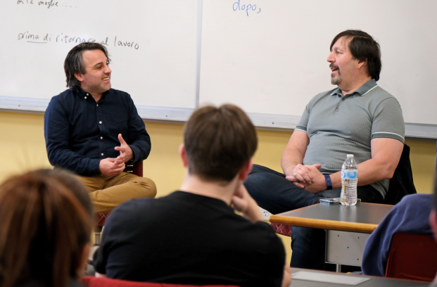 Professor Kyle Moody and RA Salvatore converse in class