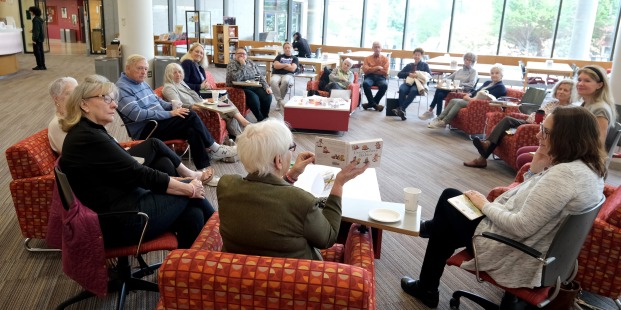 Members of ALFA, staff, faculty discussing banned books in main lounge