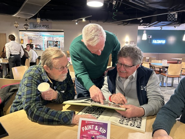 SGA reunion alumni reminisced with old yearbooks