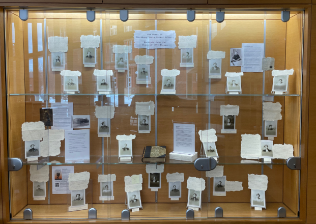 Display window of black and white portrait photos and tex
