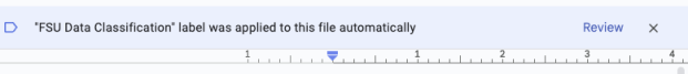 The data classification message displayed in Google Workspace: "FSU Data Classification label was applied to this file automatically."