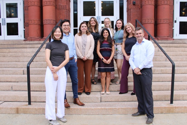 Group photo of the counseling services staff on steps of Thompson Hall