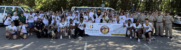 Staff, faculty, alumni, students getting ready to walk in the parade.
