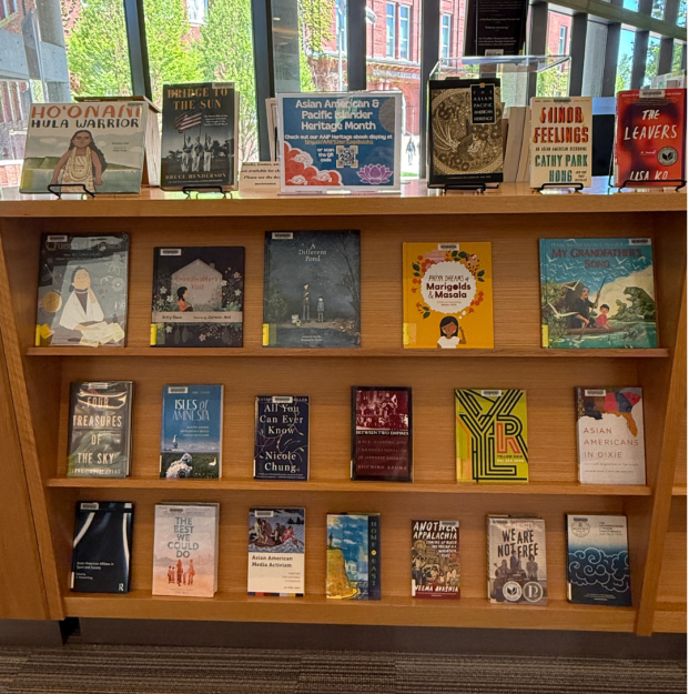 Books displayed on a library shelf for Asian American and Pacific Islander Heritage Month.