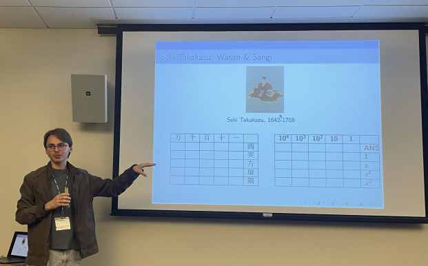 Male student presenting his math project at Undergrad Research Conference.