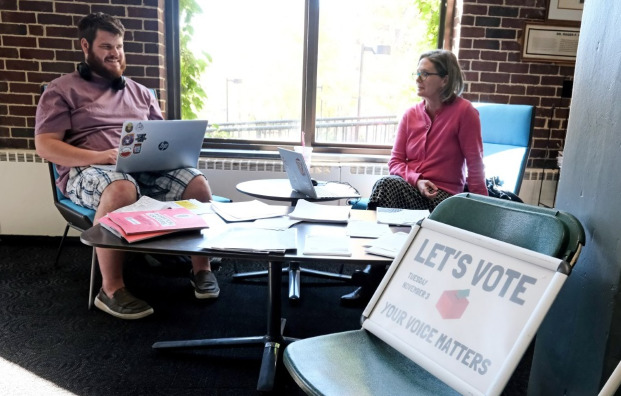 Elliot and Connie giving voting info in Holmes.