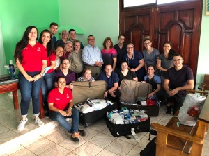 Group of nursing students with suitcases of supplies in Costa Rica