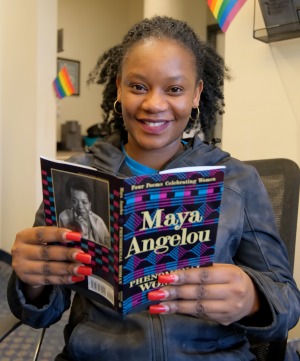 Student reading Maya Angelou book in CDI office