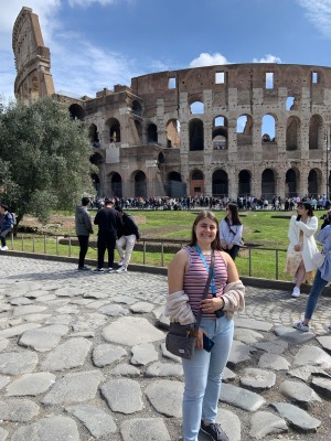 Sophia in front of colosseum in Italy