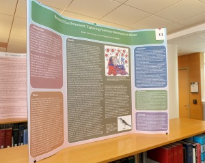 Academic trifold poster on display on top of a book case