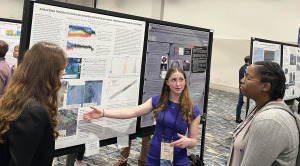 Student Madison Ambrogi '26 and alum Kate Messer 24 presenting research in Texas