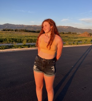 Cassie Israelson outside on street with mountains in background