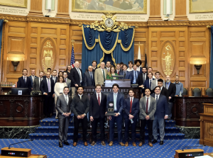 Men's ice hockey team in legislative chamber May 2025