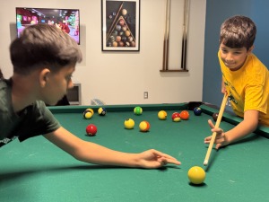 Students playing pool on campus during the Future Falcon Academy