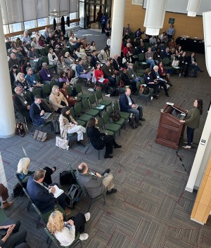 President Donna Hodge speaks at podium during civic engagement discussion in October 2025