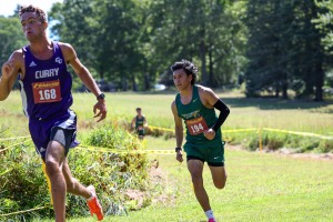 Cross country freshman runner Paulino Guevara Mateo competing on the course