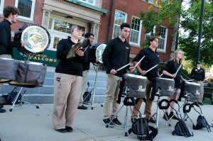 Drumline at homecoming rally playing in front of Edgerly Hall.