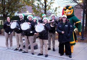 Drumline posing in Highland Plaza with Freddy.