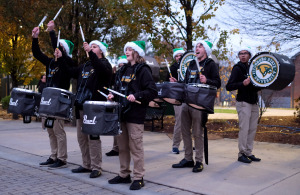 Drumline playing at the tree lighting in Highland Plaza.