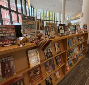 Display of books on wooden shelves