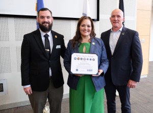 Nolan Buck presents Donna Hodge with a veteran award