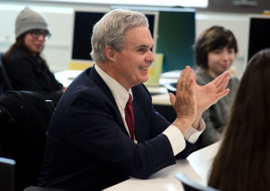 District attorney Joe Early claps in Kyle Moody's class