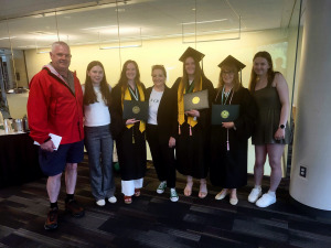 Hart family graduation with dad and President Hodge