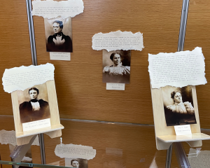 Display of four vintage women portraits with accompanying text about education.