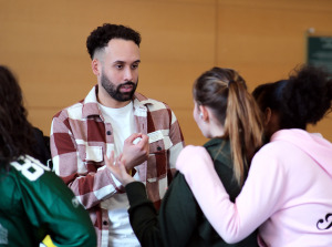 High school students talking with Eliezer Rivera during Accepted Students Visit Day
