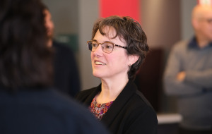 Laura Robinson library dean talking to staff