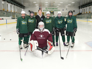 Olympian Gigi Marvin poses with club hockey members at the Wallace Civic Center.