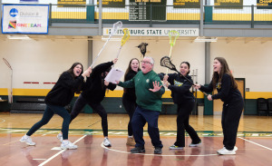 Women's lacrosse players have some fun with retiring coach Rick Terrio