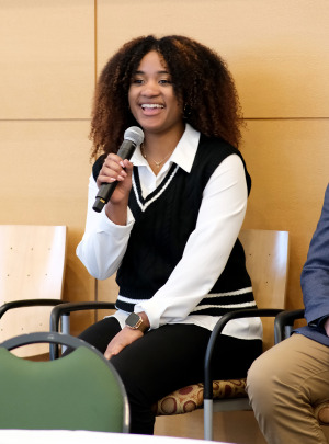 Math student Rohanji “Anji” Novas talking before the Board of Trustees meeting
