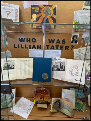 Display case with books, papers, and a sign reading "WHO WAS LILLIAN TATER?"