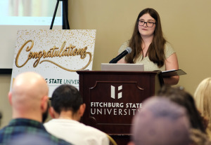 Leominster High junior Emma Wood reads her first-place essay in the writing contest.