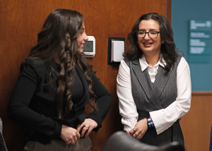 Amanda DeLeon Guimaraes talks with a fellow student