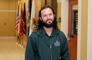 Evan Pritchard employee flags in background