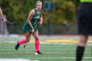 Graduate Olivia Narkevicius playing field hockey