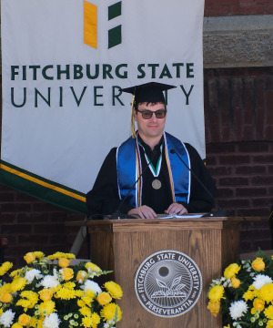 Charlie Stevenson address the audience at commencement