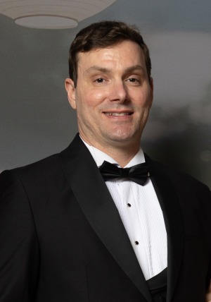 Charles Stevenson in suit at Gala wins Antonucci award