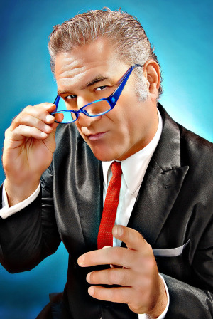 Jimmy Mazz pointing with glasses. 