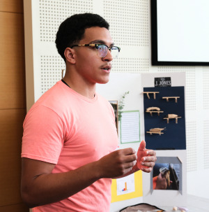Jayden Jones presents his project during Upward Bound Math & Science Student Showcase