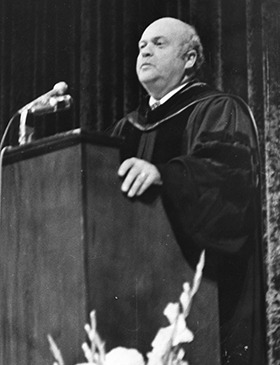 Dr. Vincent J. Mara speaking at a podium